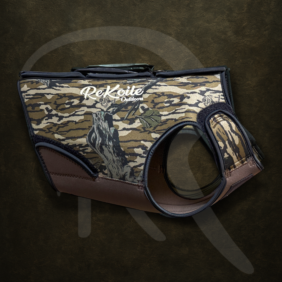 Mossy Oak Treestand patterned duck hunting dog vest with ReKoile Outdoors logo on a dark background
