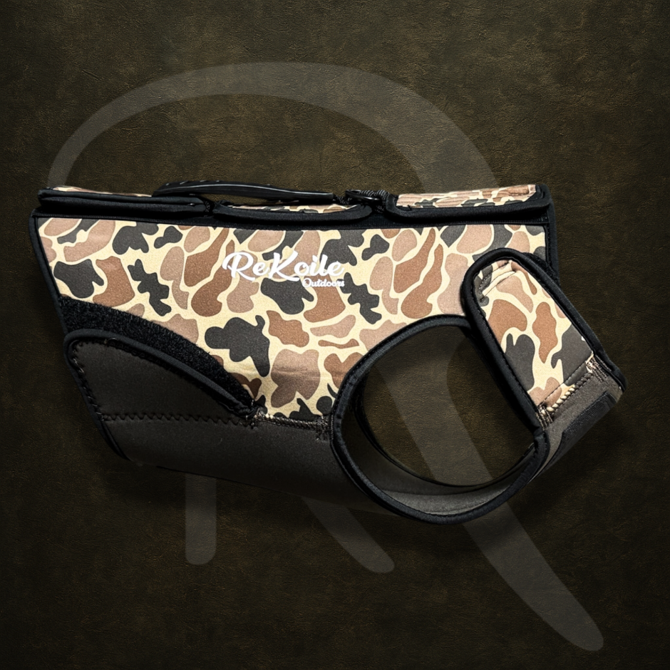 Camo-patterned hunting dog harness with ReKoile brand logo on a dark background
