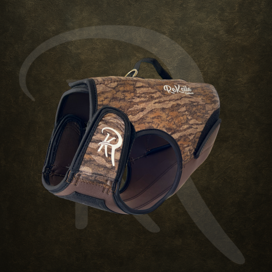 Mossy Oak dog harness on a dark background