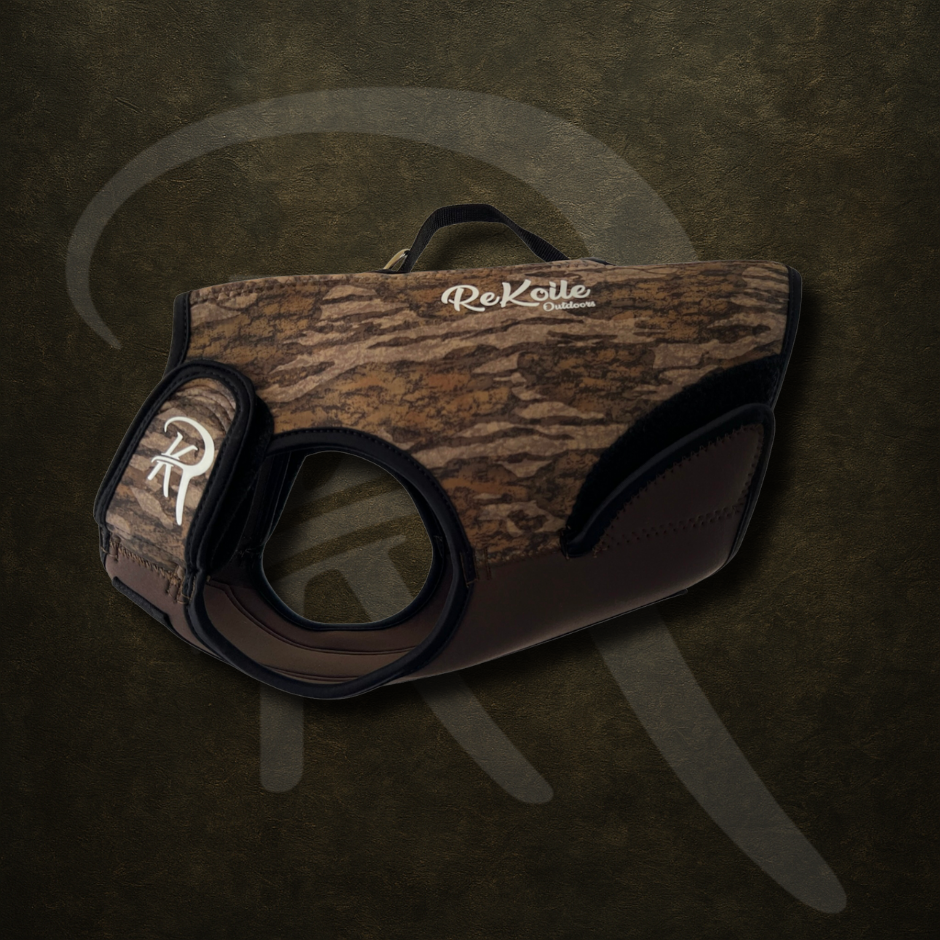 Camo-patterned neoprene dog vest with ReKoile logo on a dark background